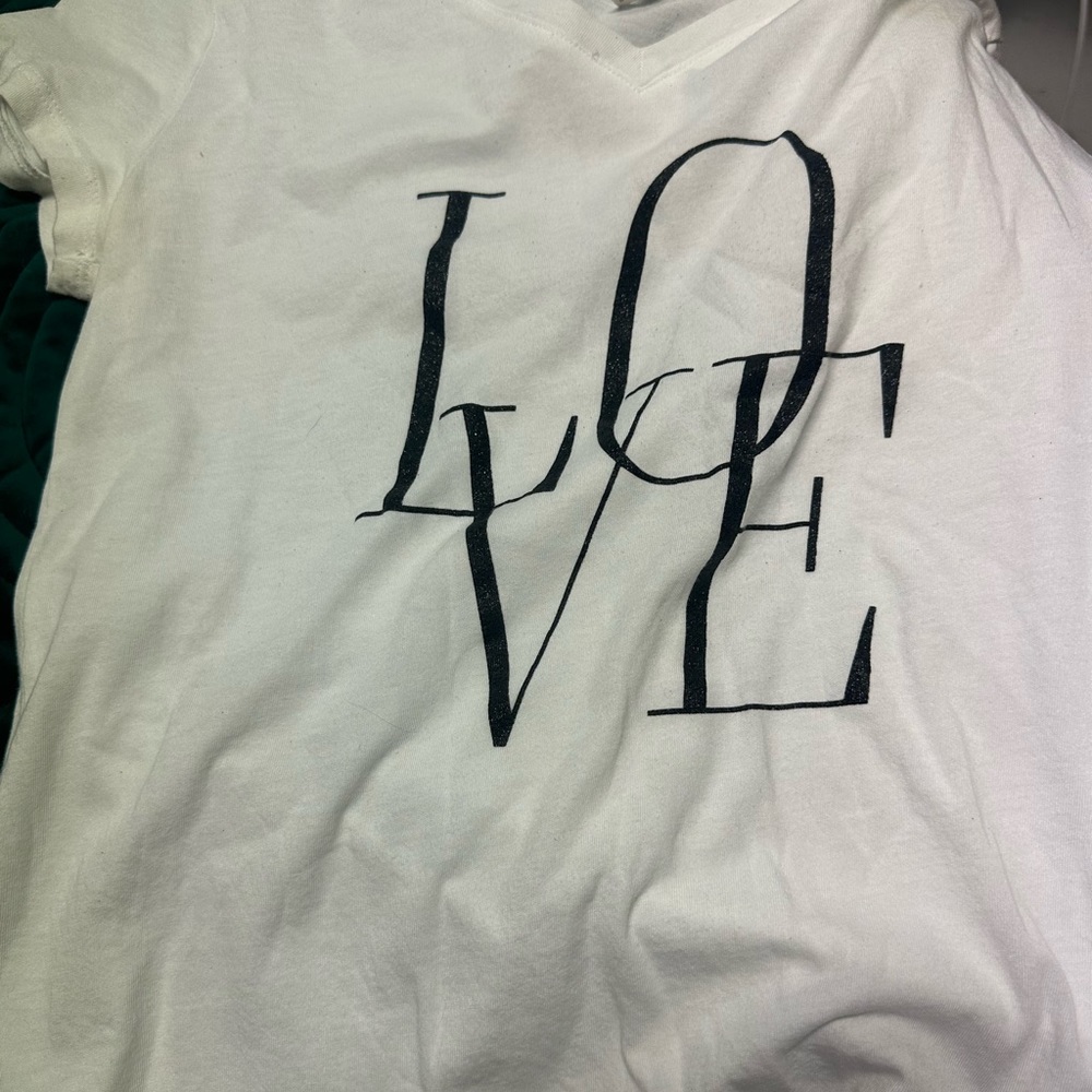 Lightweight, white, short sleeve, V neck t-shirt. SUPER SOFT size small